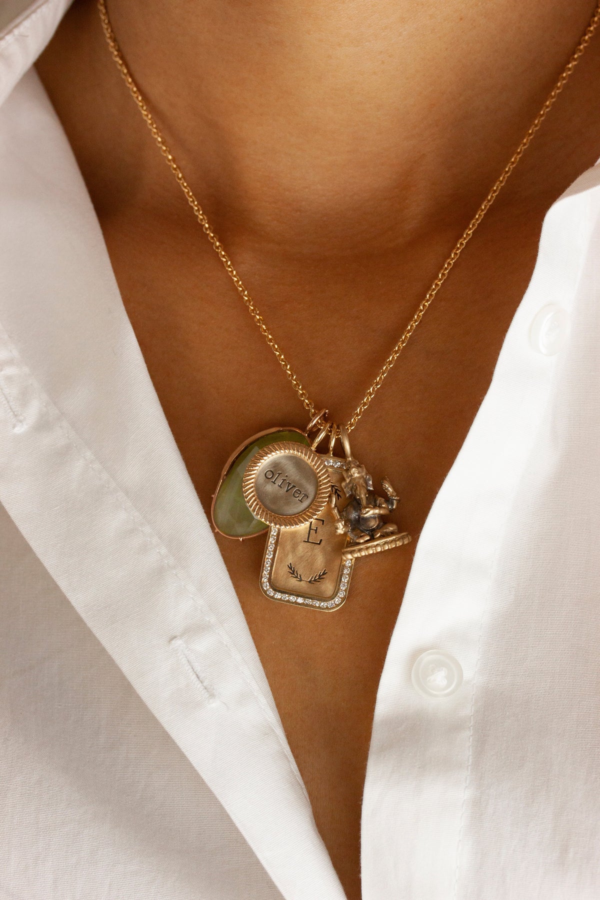 Model wearing layered Heather B. Moore personalized charm necklaces